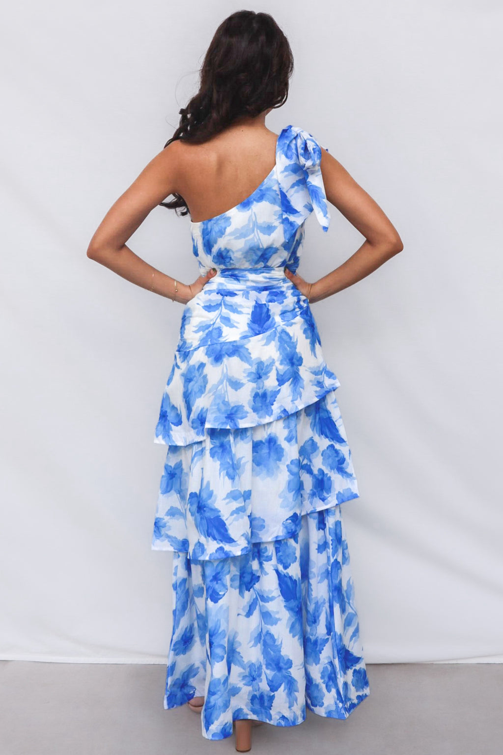 Antonia Maxi Dress - Blue Floral One Shoulder Bow Tie Tiered Skirt Runway Goddess Antonia Maxi Dress - Blue Floral One Shoulder Bow Tie Tiered Skirt Runway Goddess