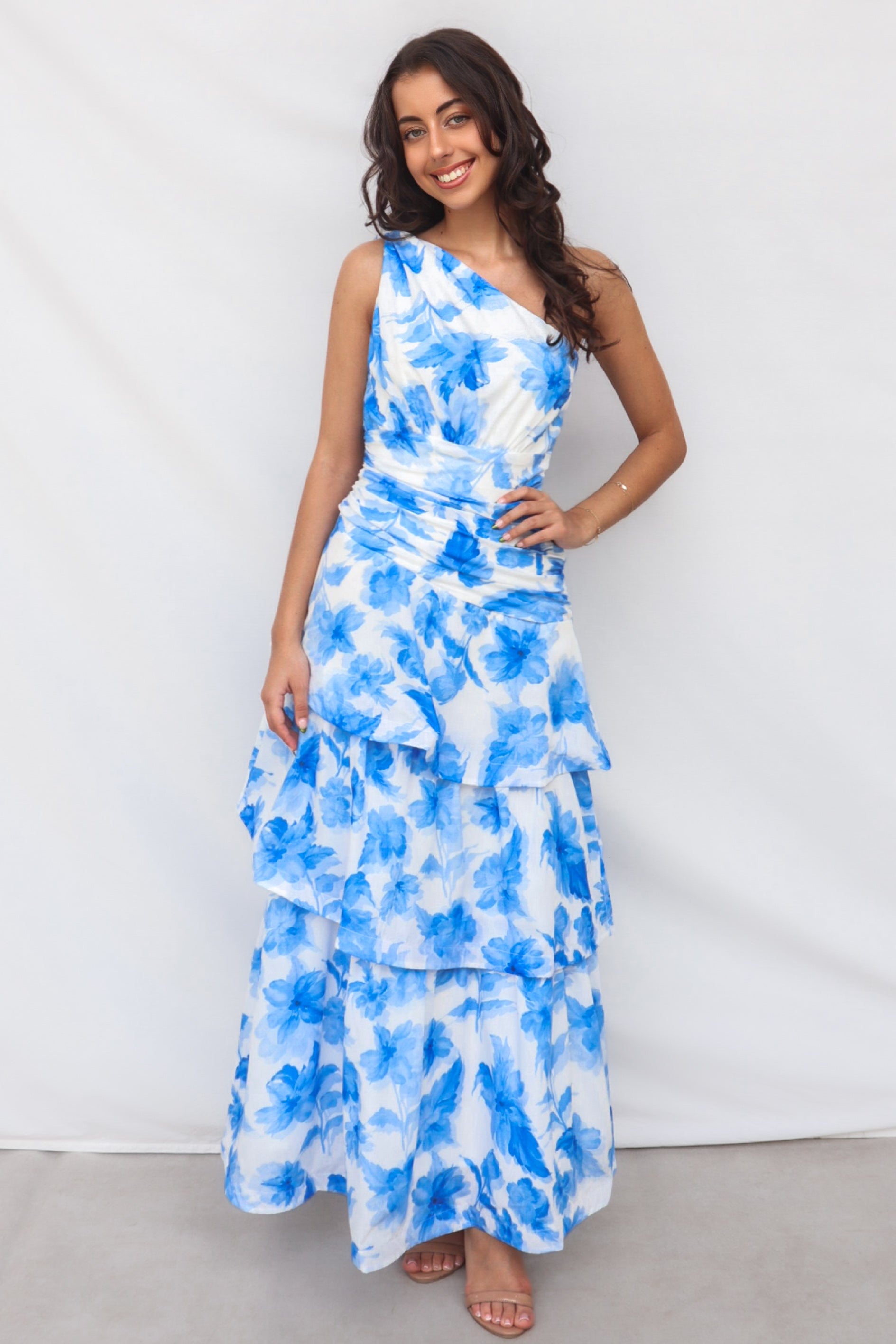 Antonia Maxi Dress - Blue Floral One Shoulder Bow Tie Tiered Skirt Runway Goddess Antonia Maxi Dress - Blue Floral One Shoulder Bow Tie Tiered Skirt Runway Goddess